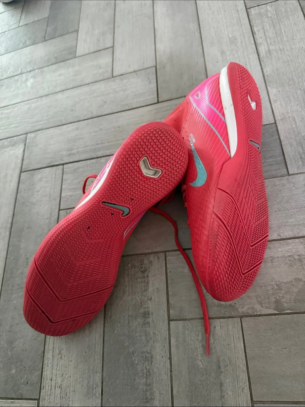 Nike Red Soccer turf Cleats with Teal Swoosh Accents